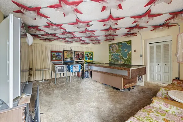 a bedroom with furniture and a baby crib