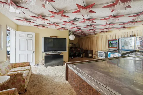 a table tennis table and chairs in a room