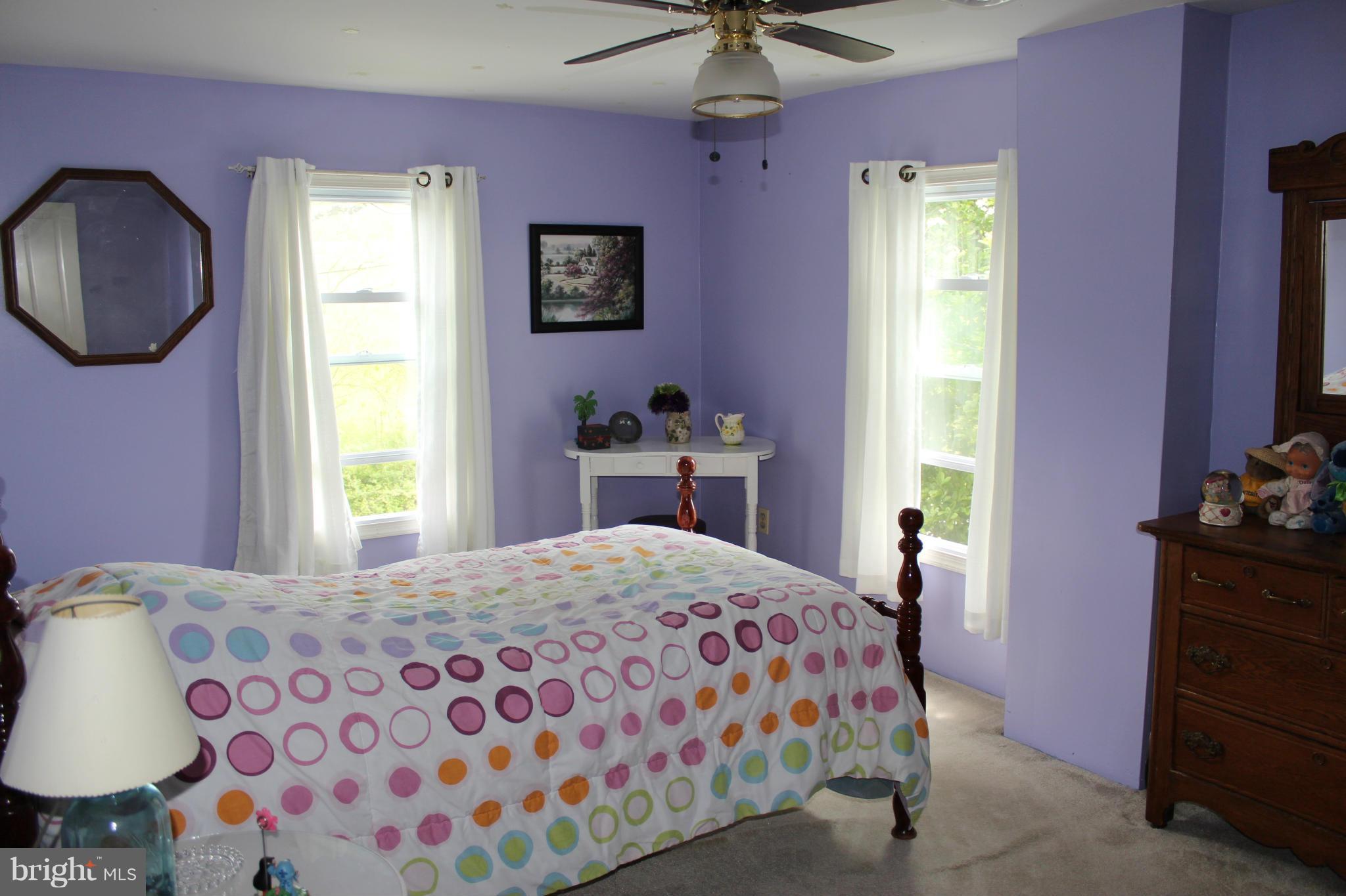 11191 Big Pool Road Big Pool, MD 21711 - Photo 21 of 30 a bedroom with a bed dresser and a window