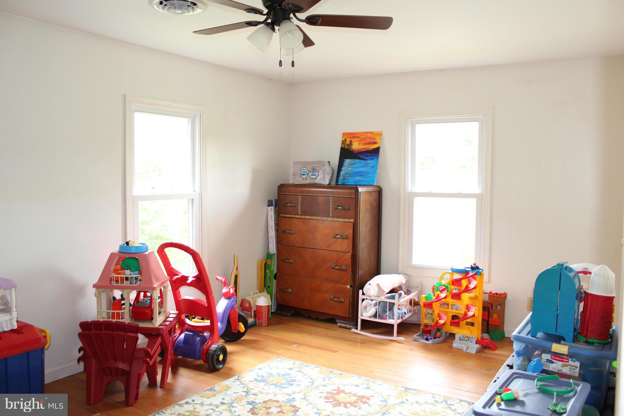 11191 Big Pool Road Big Pool, MD 21711 - Photo 22 of 30 a bedroom with toys and a chandelier