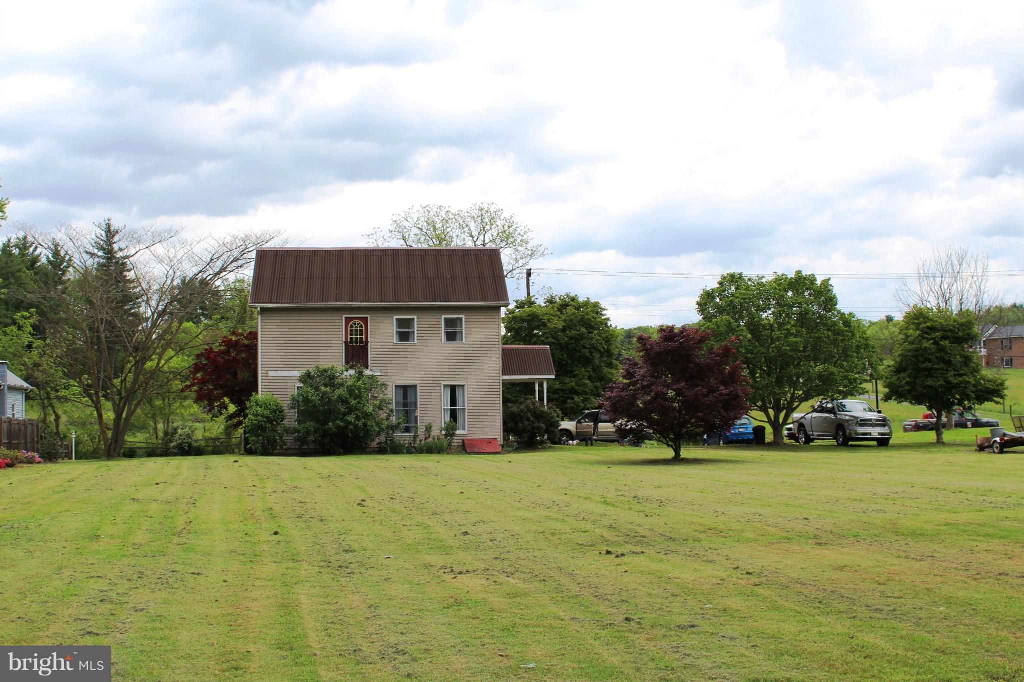 11191 Big Pool Road Big Pool, MD 21711 - Photo 23 of 30 a front view of house with yard and green space