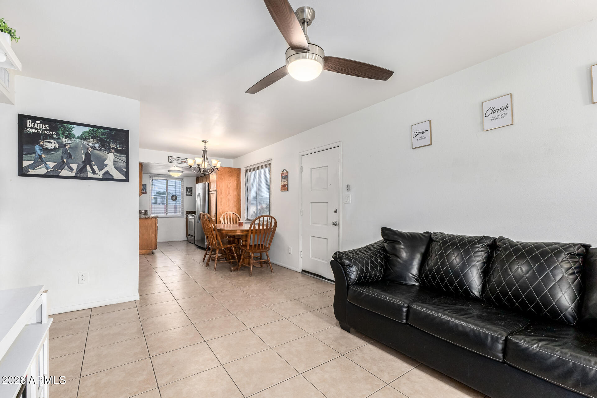 600 South Dobson Road, Unit 122 Mesa, AZ 85202 - Photo 2 of 28 a living room with furniture and a chandelier
