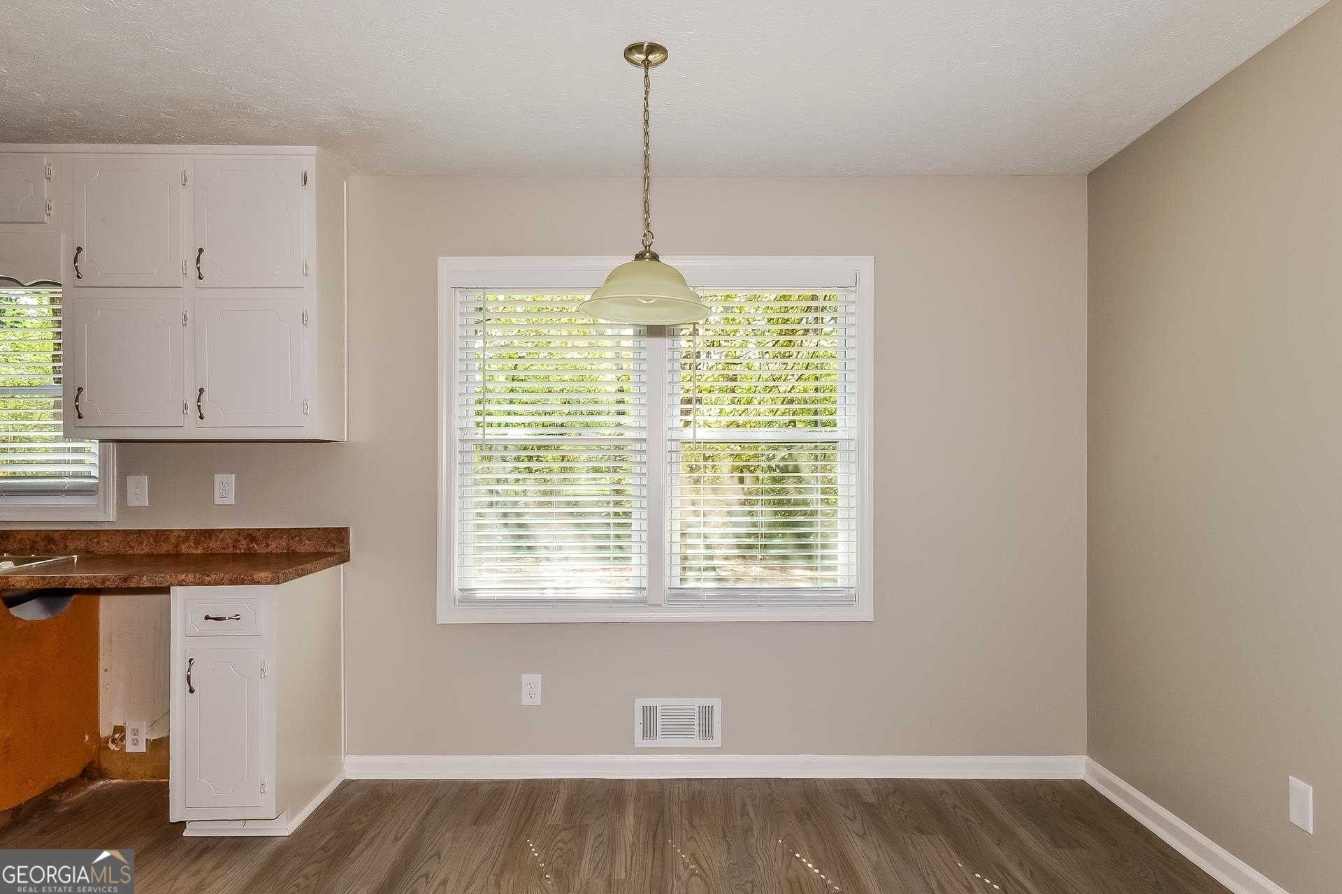 109 Landover Drive Stockbridge, GA 30281 - Photo 5 of 16 a kitchen with appliances cabinets and a wooden floor