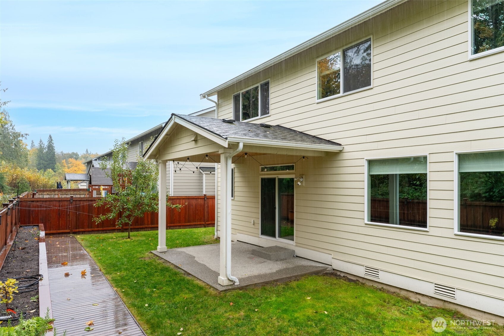 730 10th Street Sultan, WA 98294 - Photo 4 of 39 a view of a house with a yard and large tree