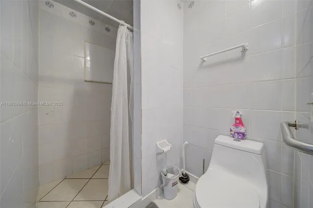 a view of a porch with chairs and a table