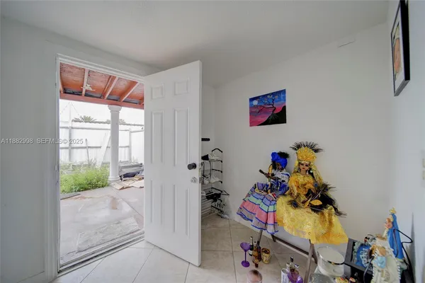 a bedroom with furniture and a window
