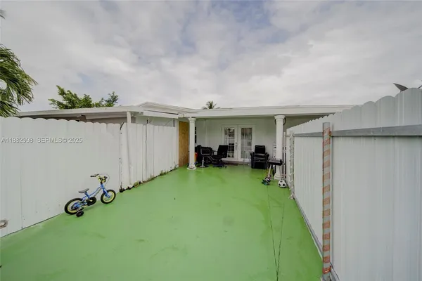 a living room with furniture a rug and a table