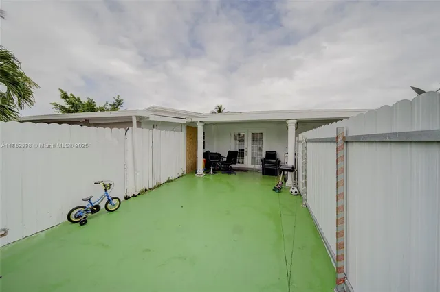 a living room with furniture a rug and a table