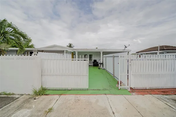 a kitchen with a refrigerator and a sink