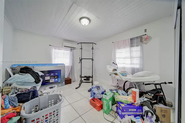 a spacious bedroom with a bed and a couch