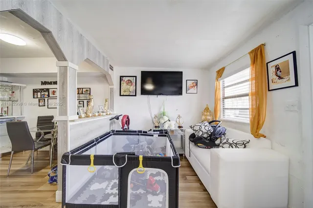 a bathroom with a toilet and a shower curtain