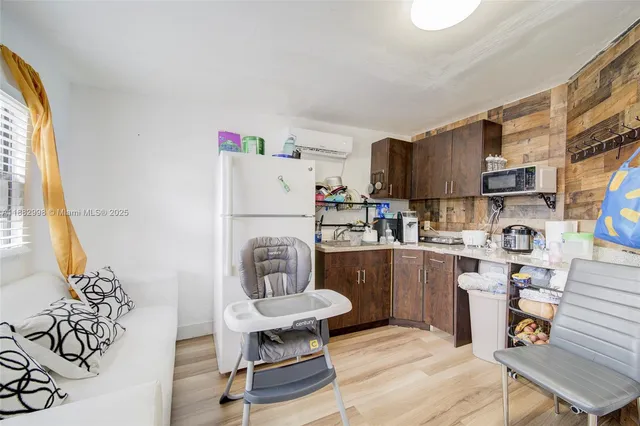 a view of a swimming pool with a yard and palm trees