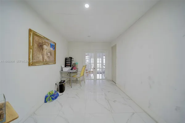 a kitchen with granite countertop stainless steel appliances and refrigerator