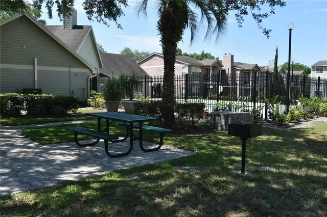 a view of a park with a bench in patio