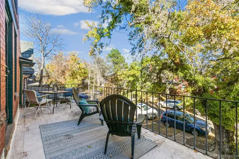 front view of a house with a outdoor seating