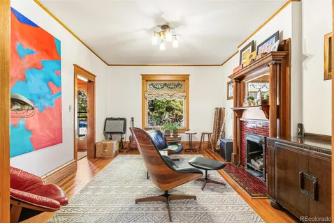 a living room with furniture and large windows