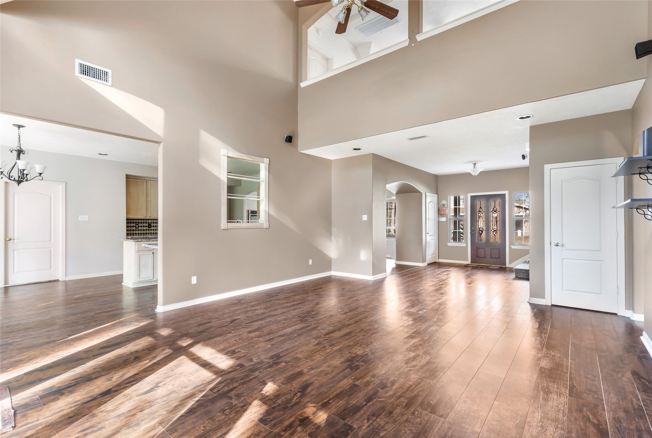 123 Burwell Road Highlands, TX 77562 - Photo 11 of 32 a view of a hallway with wooden floor
