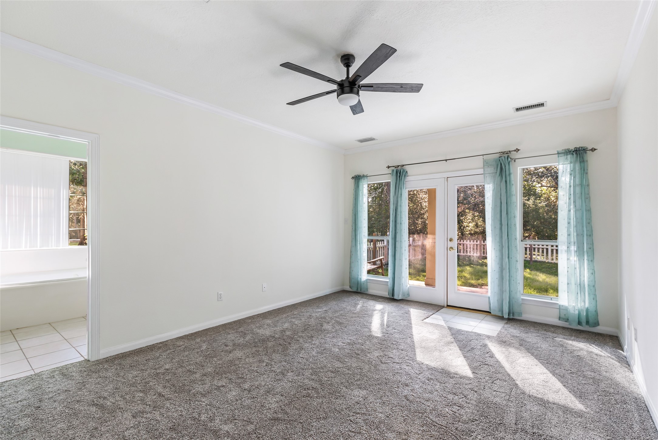 123 Burwell Road Highlands, TX 77562 - Photo 15 of 32 a view of a livingroom with a ceiling fan and window