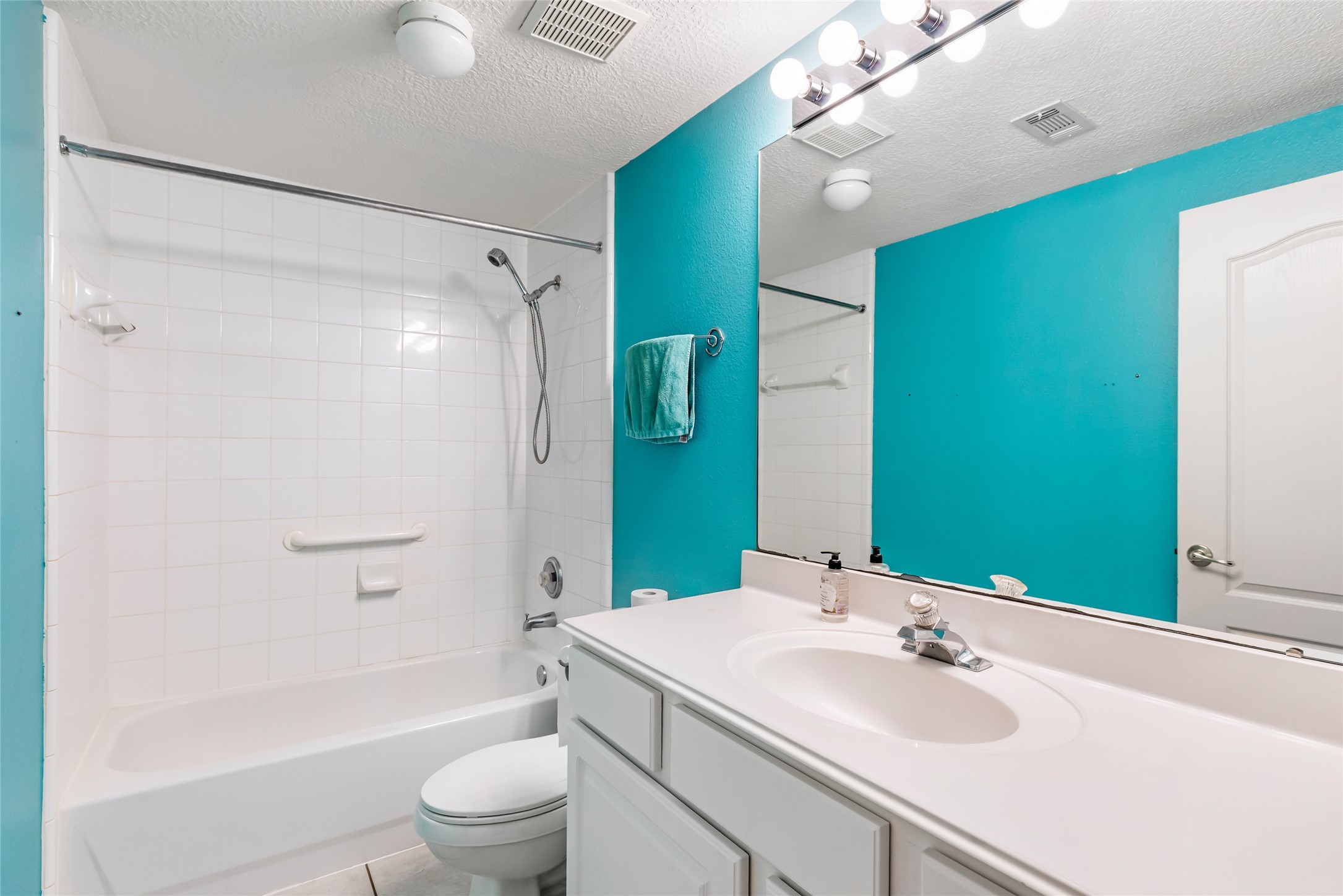 123 Burwell Road Highlands, TX 77562 - Photo 20 of 32 a bathroom with a sink a toilet and shower