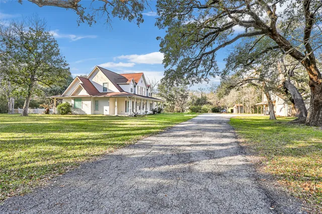 a view of a house with a big yard