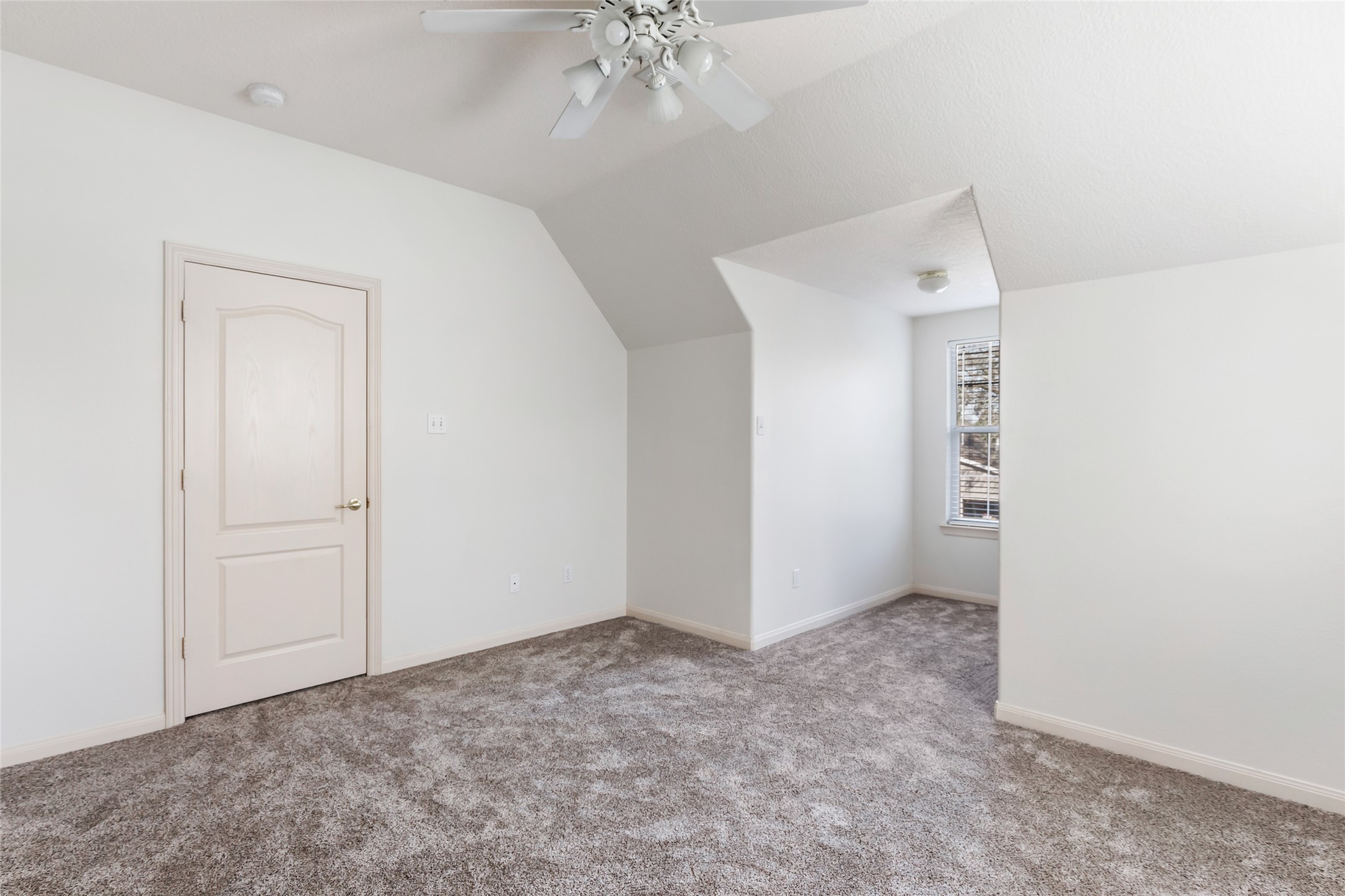 123 Burwell Road Highlands, TX 77562 - Photo 26 of 32 a view of an empty room with a chandelier fan