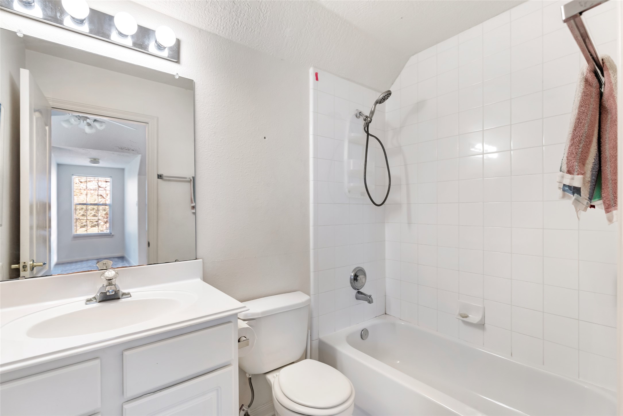 123 Burwell Road Highlands, TX 77562 - Photo 27 of 32 a bathroom with a sink toilet tub vanity and shower