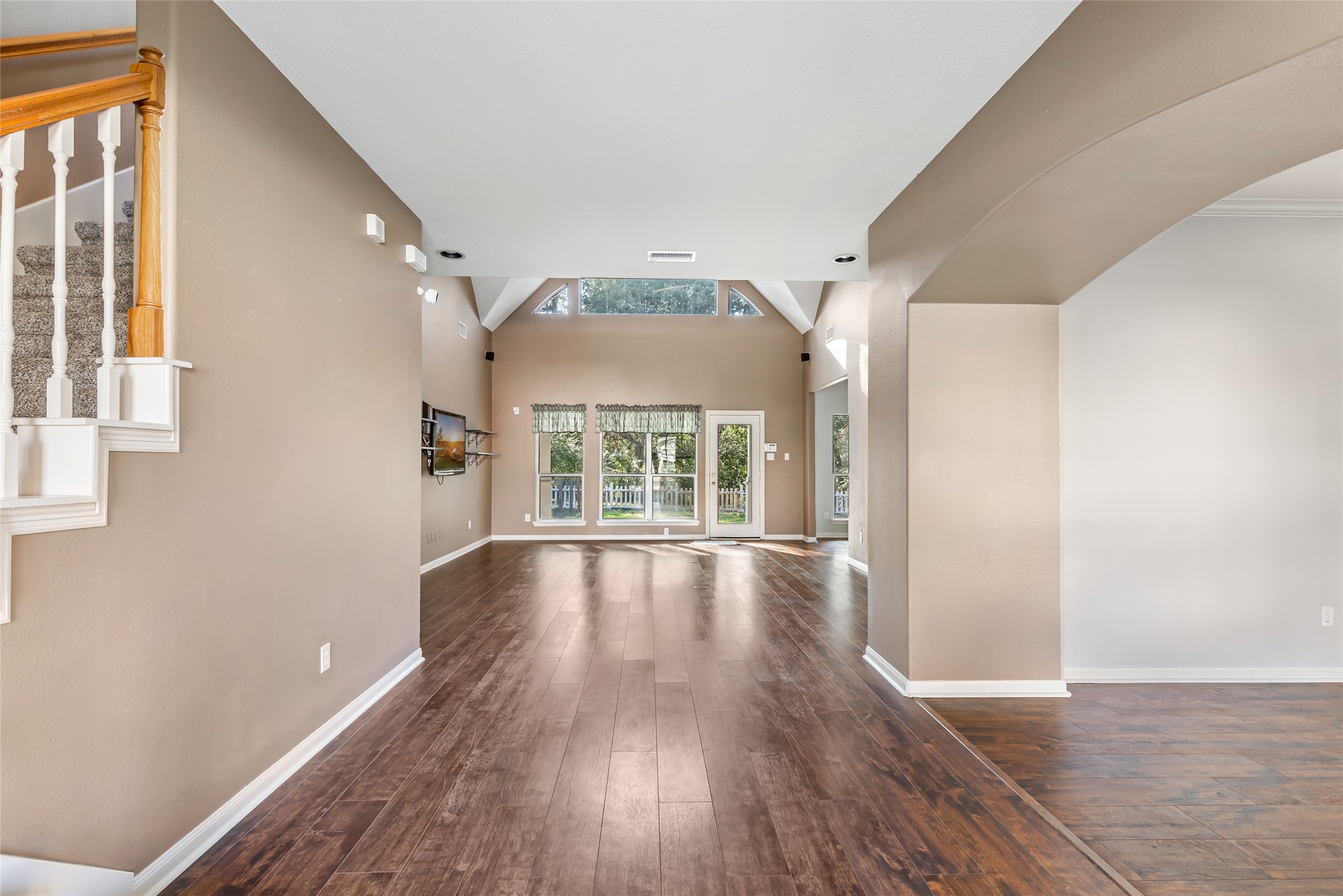 123 Burwell Road Highlands, TX 77562 - Photo 6 of 32 wooden floor in an empty room with a window