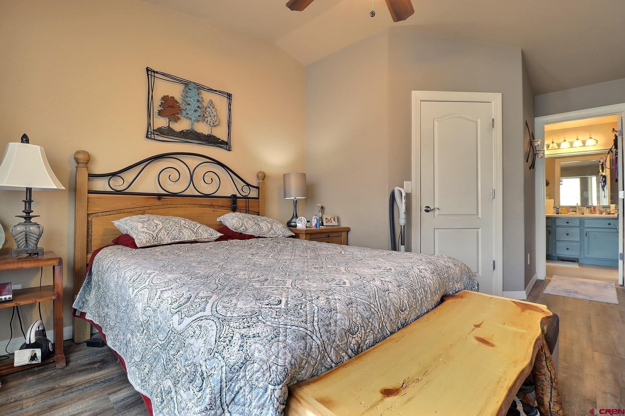 786 Dutton Street Delta, CO 81416 - Photo 11 of 29 The walk in closet in the primary bedroom with the doorway into the 4 piece bath area