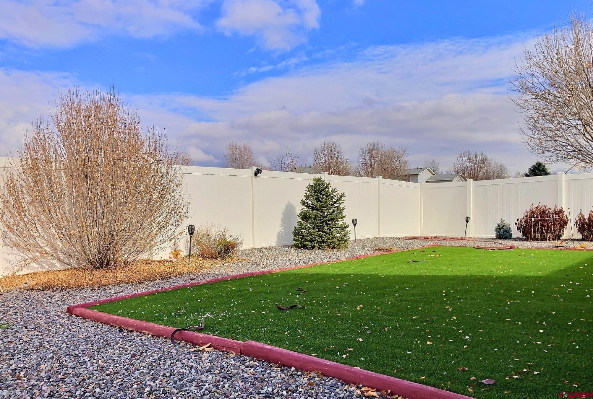 786 Dutton Street Delta, CO 81416 - Photo 3 of 29 with the artificial grass. A Putting Green or just a place you don't have to mow!