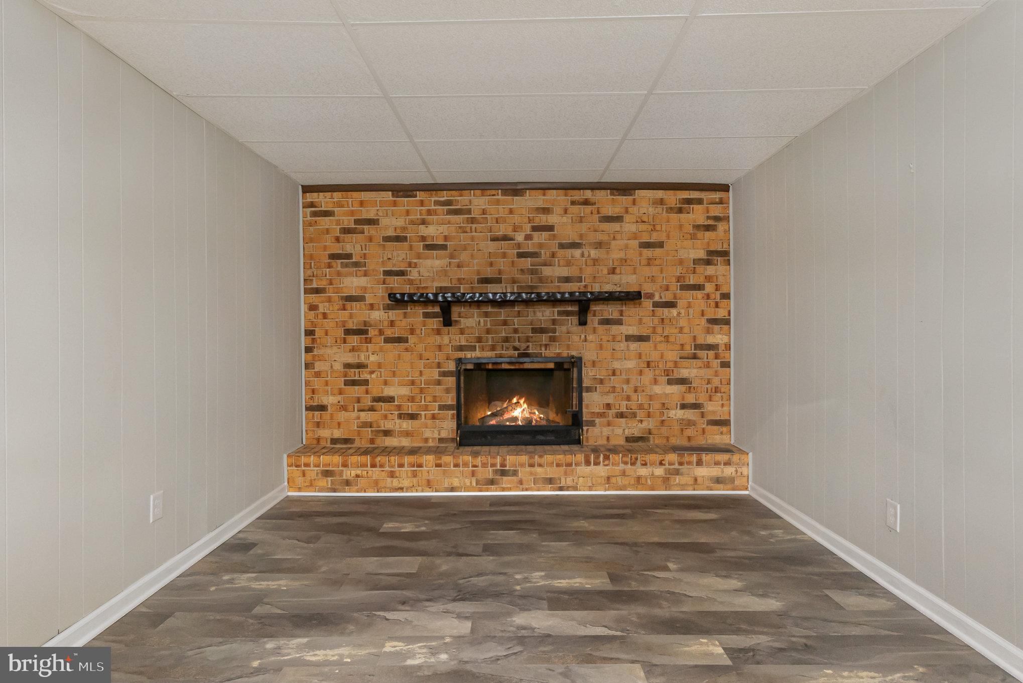 8017 Hillendale Road Parkville, MD 21234 - Photo 14 of 28 Lower Level - virtual fire. Seller has not used FP