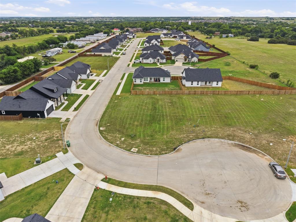 585 Highview Court Godley, TX 76044 - Photo 4 of 15 a view of a swimming pool with a garden