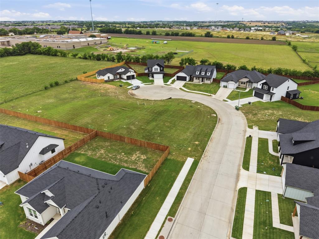 585 Highview Court Godley, TX 76044 - Photo 7 of 15 an aerial view of a house with a garden and lake view