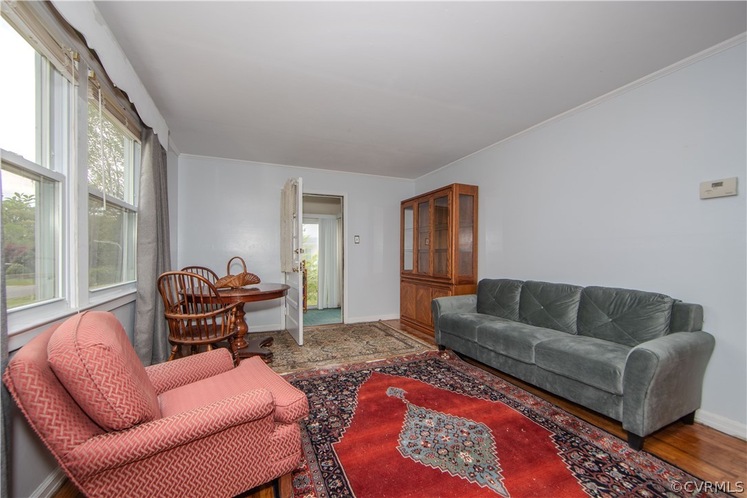 6736 Strathmore Road Richmond, VA 23237 - Photo 11 of 25 a living room with furniture wooden floor and a large window
