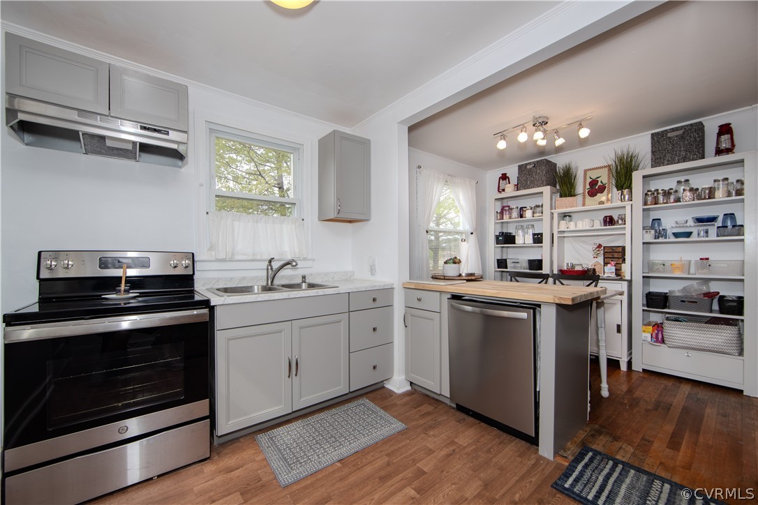 6736 Strathmore Road Richmond, VA 23237 - Photo 13 of 25 a kitchen with stainless steel appliances granite countertop a stove and a sink