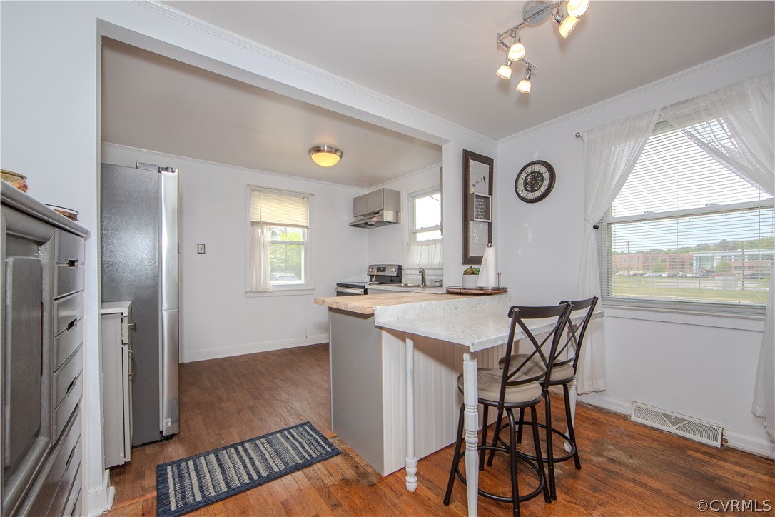 6736 Strathmore Road Richmond, VA 23237 - Photo 14 of 25 a view of a kitchen and dining room