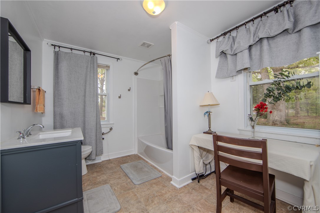6736 Strathmore Road Richmond, VA 23237 - Photo 17 of 25 a bathroom with a sink and a mirror