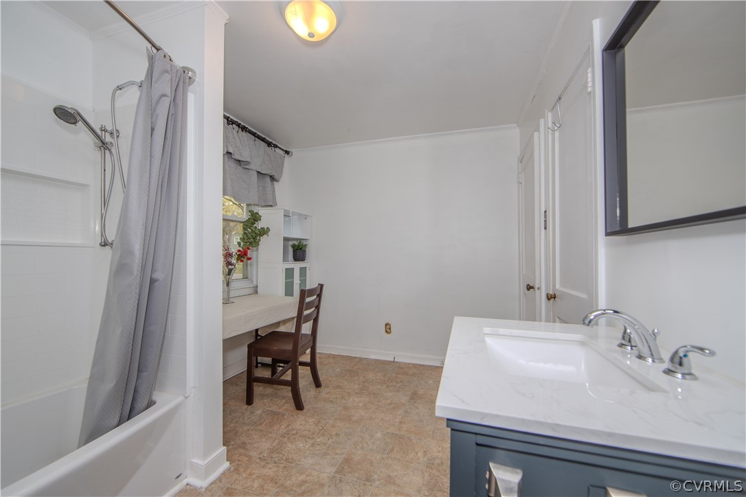 6736 Strathmore Road Richmond, VA 23237 - Photo 18 of 25 a bathroom with a sink and a mirror