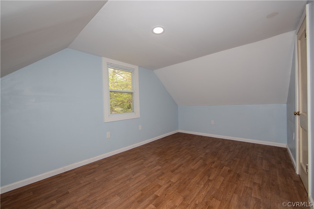 6736 Strathmore Road Richmond, VA 23237 - Photo 21 of 25 an empty room with wooden floor and windows