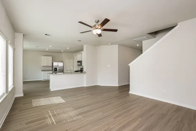 a view of a kitchen with a sink and a window