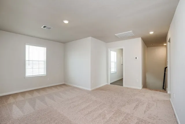a view of an empty room with a window