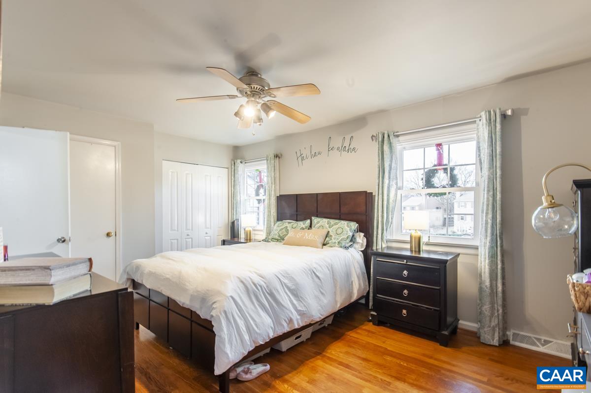 145 Georgetown Green Charlottesville, VA 22901 - Photo 14 of 43 a bedroom with a bed and a chandelier
