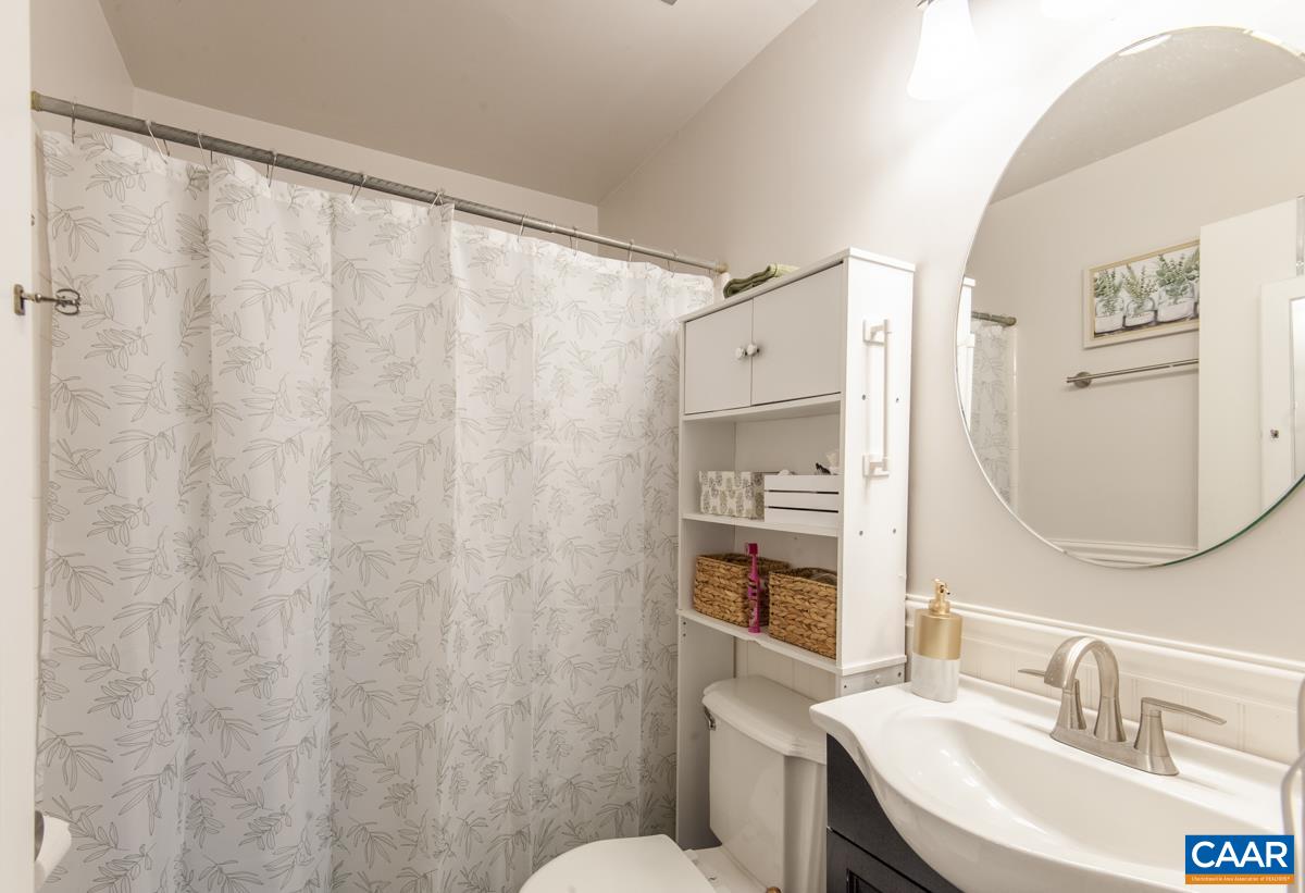 145 Georgetown Green Charlottesville, VA 22901 - Photo 15 of 43 a bathroom with a sink and a mirror