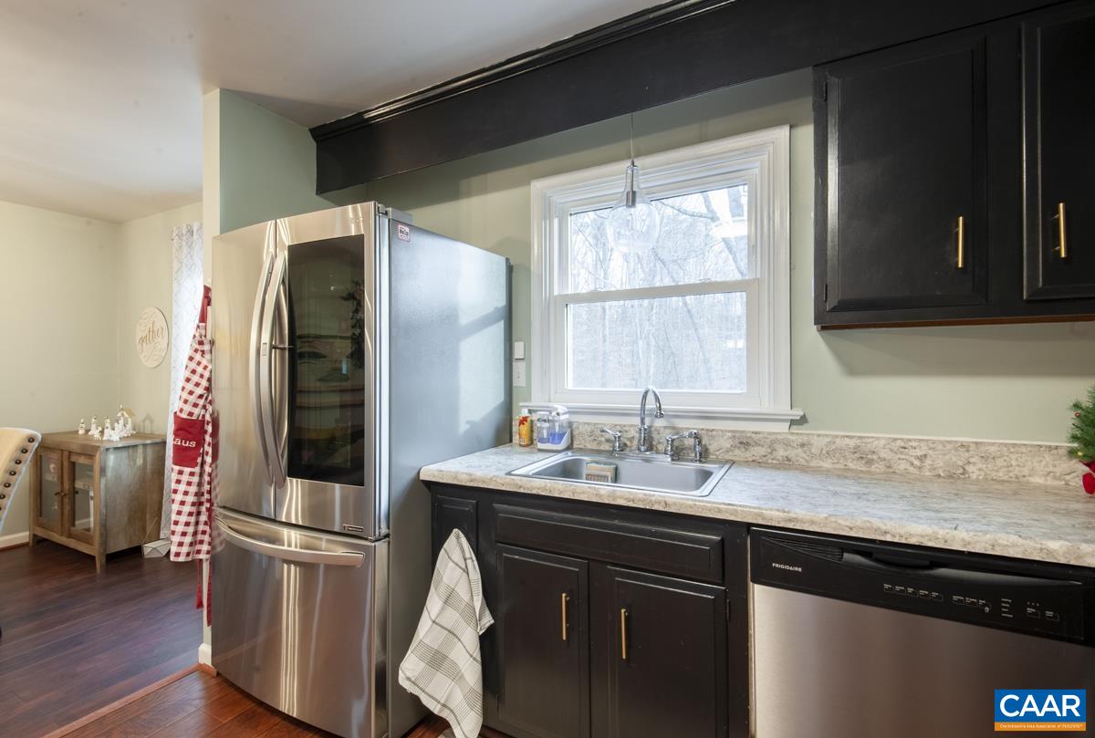 145 Georgetown Green Charlottesville, VA 22901 - Photo 10 of 43 a kitchen with a refrigerator and a sink
