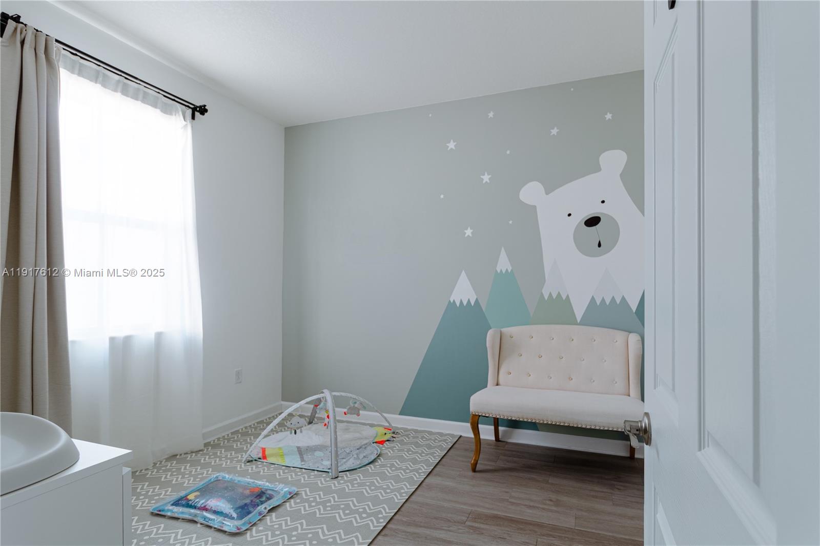 3435 West 105th Street Hialeah, FL 33018 - Photo 19 of 41 a living room with furniture and a table