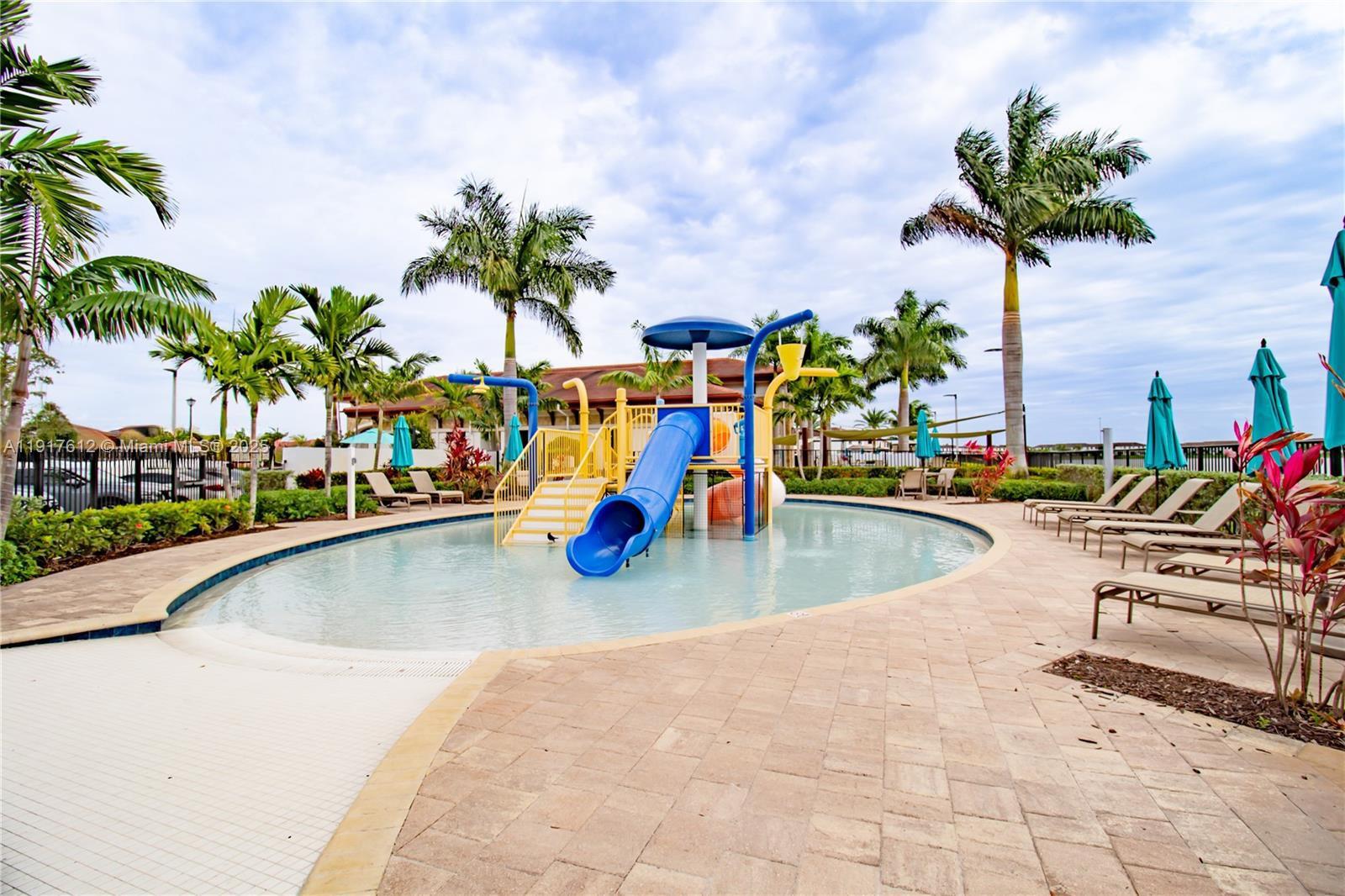 3435 West 105th Street Hialeah, FL 33018 - Photo 36 of 41 a view of a swimming pool with a lounge chair