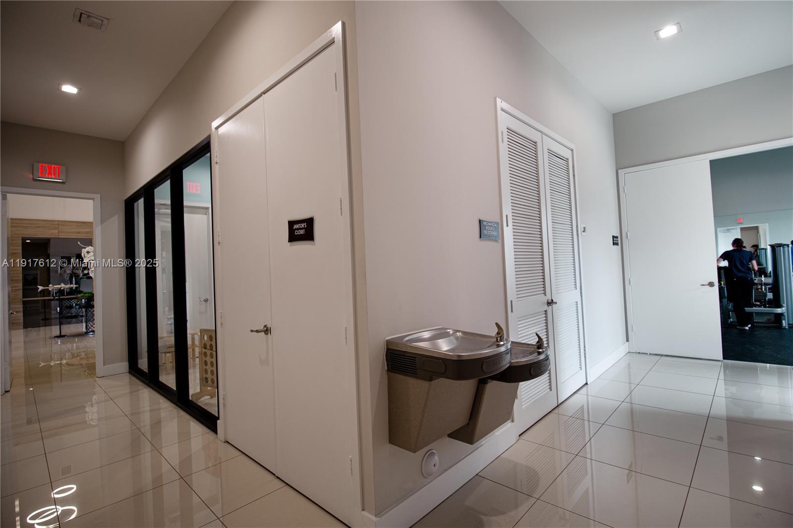 3435 West 105th Street Hialeah, FL 33018 - Photo 38 of 41 a view of a hallway and a livingroom with furniture