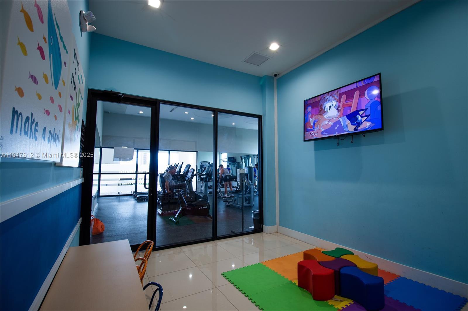 3435 West 105th Street Hialeah, FL 33018 - Photo 40 of 41 a living room with furniture and wooden floor