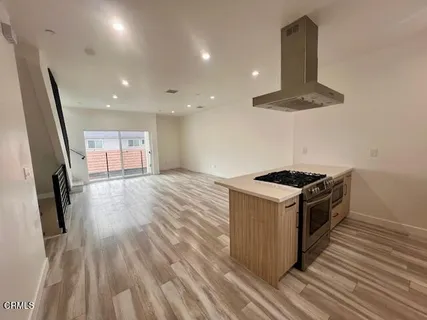 a bathroom with a toilet a sink and a window