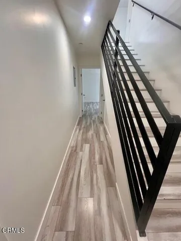 a view of a room with closet and wooden floor