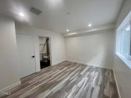 a bathroom with a sink toilet a mirror and shower
